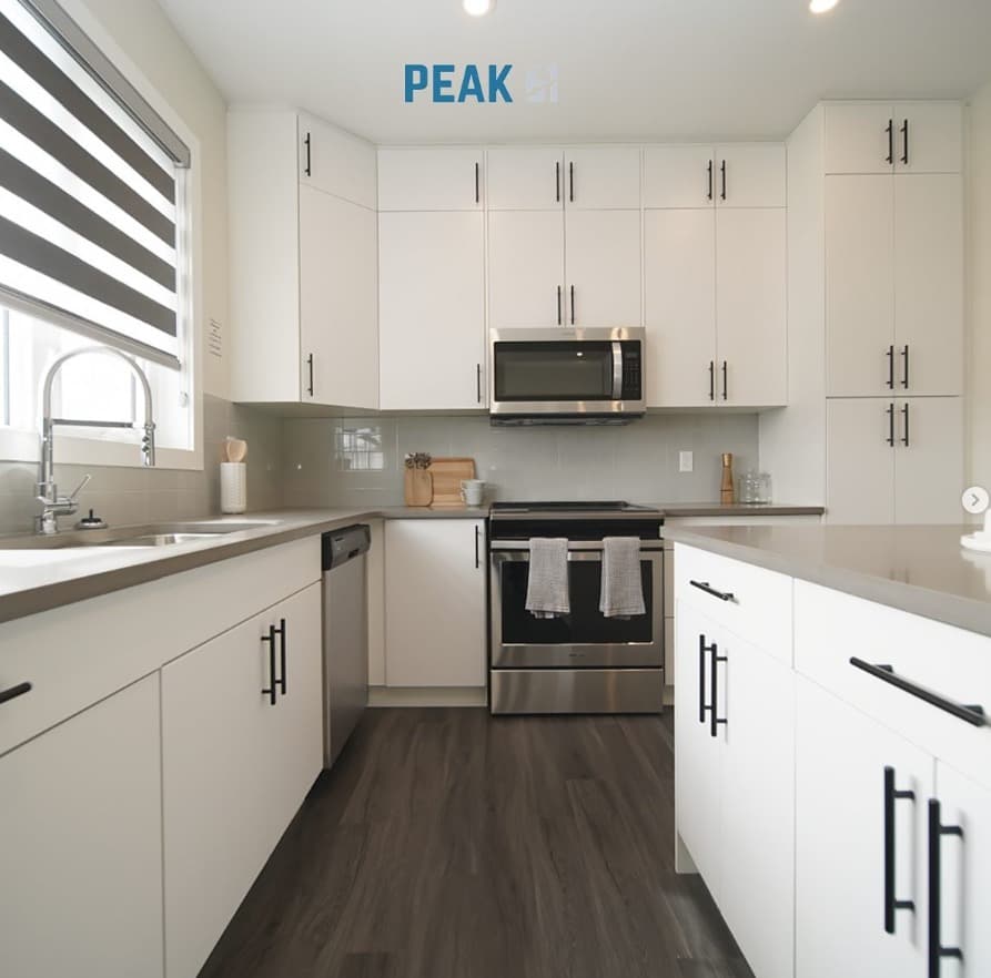 Townhome kitchens typically include ample cabinet space for storage. These cabinets may come in a variety of finishes and styles, ranging from traditional to modern. Some townhomes may feature tall cabinets reaching up to the ceiling, maximizing storage capacity.
